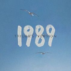 two seagulls flying in the sky and one is writing 1989