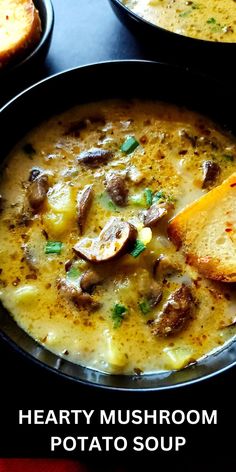 a bowl of hearty mushroom potato soup with two slices of bread on the side