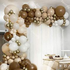 balloons are arranged in the shape of an arch for a balloon display at a party