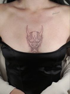 a woman with a tattoo on her chest