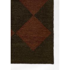 an area rug with brown and green squares on the side, in front of a white background