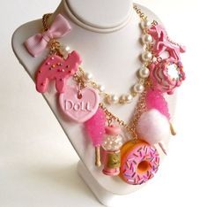 This kawaii statement necklace features tons of fun pink charms inspired by all things cute nostalgic and magical, making this necklace a true statement piece! I designed these charms to be so realistic you might be tempted to take a taste! This statement necklace features your choice of 5, 7 or 9 charms (pictured) that hang from a high quality gold or silver plated 20" chain necklace accented with a hand-beaded glass pearl chain and pink bow. Back closes with a lobster clasp and is finished wit Pink Fun Style Charm Necklace, Fun Pink Charm Necklaces, Playful Pink Charm Necklaces, Pink Playful Party Necklaces, Playful Pink Party Necklaces, Fun Pink Charm Necklace, Playful Pink Necklaces For Party, Playful Pink Necklace For Party, Fun Pink Charm Necklace For Birthday