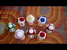 several crocheted mario brothers toys are on a table