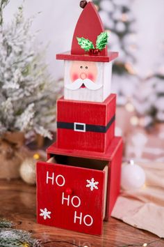 a santa clause made out of wooden boxes