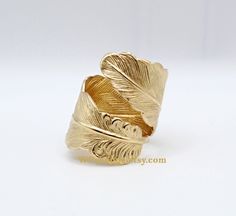 Raw brass feather wrap ring. Gold plume thumb ring. Bohemian jewelry. Handmade by Samantha Price at WPshoppe.etsy.com This golden feather ring is a must have for your bohemian jewelry collection. I make this ring using a raw brass, heavily detailed feather. It is made in a wrap style that looks striking on your thumb or index finger.  Because this is raw brass, it will oxidize over time. You can keep your brass jewelry bright gold by using a tarnish remover like Tarnex (found at your local hardw Feather Wrap, Golden Feather, Gold Wrap Ring, Tarnish Remover, Feather Ring, Thumb Ring, Wrap Ring, Bright Gold, Thumb Rings