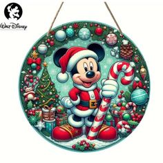 a mickey mouse christmas ornament hanging on a wall