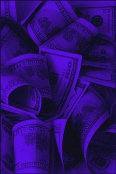 a pile of money sitting on top of a purple background with the words $ 100 in it