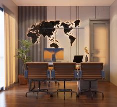 an office with a desk and chairs in front of a world map on the wall