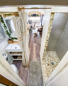 an aerial view of a bathroom with shower, sink and toilet