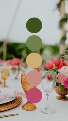 the table is set with flowers and wine glasses