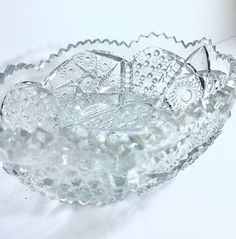 a glass bowl sitting on top of a white table