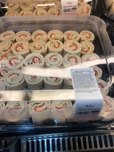 there are many rolls on display in the case at this store, and one is for sale