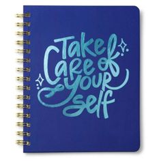 a spiral notebook with the words take care of your self written on it in blue