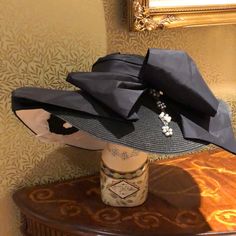 This Is A Beautiful Black And White Oversized Brim Chapeau With A Black Silk Taffeta Bow. It Also Has Vintage Beading Down The Side. The Underside Has A Large Black And White Rosette Flower. The Flower Adds A Bit Of Fun Surprise And Interest. It Is Lined With Black And White Polka Dot Cotton Fabric. Rosette Flower, Large Brim Hat, Silk Taffeta, Brim Hat, Black Silk, White Polka Dot, Large Black, Polka Dot, Polka Dots