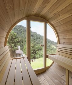 a wooden bench sitting in front of a round window