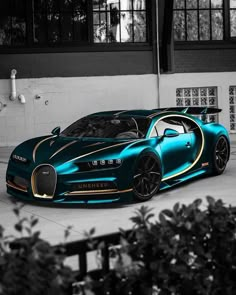 a blue bugatti parked in front of a building