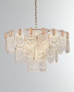 a chandelier hanging from a gold chain