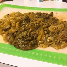 some food is laying on a green and white platter, ready to be eaten