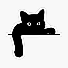 a black cat sitting on top of a table with its paw resting on the edge