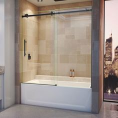 a bath tub sitting next to a window with a cityscape in the background