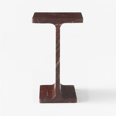 a marble table with a wooden base on white background in the shape of a letter t