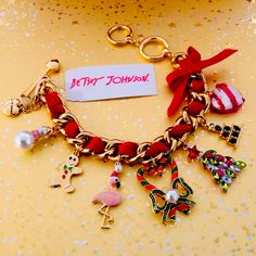 Gorgeous Authentic Betsey Johnson Christmas Charm Bracelet - Seven Different Charms, And Betsey Logo Heart. It Has A Toggle Closure That Is Adjustable 1”. Bracelet Measures 7.5”-8.5”. Gold Tone. Charms Are Red And White Heart, Small Rhinestone Tree, Large Crystal Stone Tree, Heart With Pearl Wreath, Flamingo In Pearl Santa Hat, Gold Gingerbread Man And A Pearl Snowman. Beautiful Red Velvet Ribbon And Bow Runs Through The Chain. Includes Original Tag And Sent In A Black Gift Box. Adorable For Any Christmas Charm Bracelet, Pearl Snowman, Pearl Wreath, Betsey Johnson Bracelet, Red Velvet Ribbon, Charm Bracelet Gold, Tree Heart, Logo Heart, Diy Charm