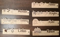 wooden rulers with names and pictures on them