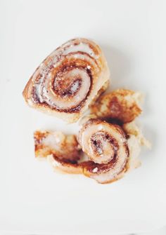 three cinnamon rolls on a white plate