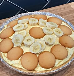 there is a pie with bananas on the top and some other toppings in it