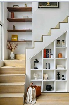 there is a book shelf under the stairs