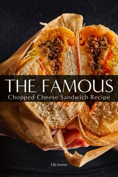 the famous chopped cheese sandwich recipe is in someone's hand with paper wrapping around it