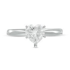 a heart shaped diamond ring on a white background