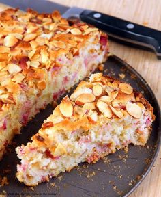 a close up of a cake on a plate with a knife