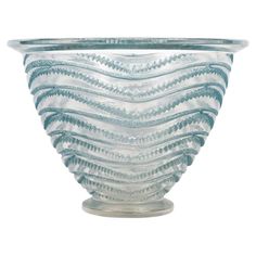 a glass bowl with wavy lines on it