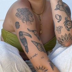 a woman with many tattoos on her arm