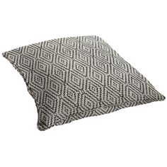 a black and white pillow on a white background