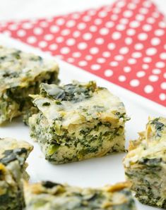 several pieces of broccoli and cheese on a plate