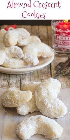 homemade almond crescent cookies on a plate with the words almond crescent cookies in front of it