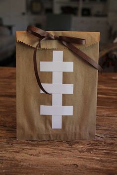 a paper bag with a football design on it