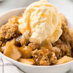 a bowl filled with ice cream and apple crisp