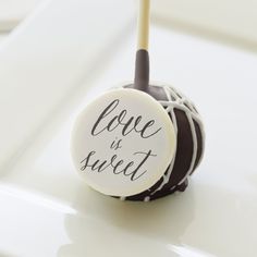 a chocolate covered cake pops with the word mr and mrs printed on it's top