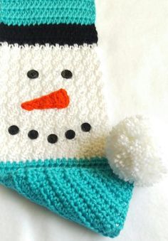 a crocheted snowman hat and scarf