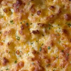 a cheesy casserole with cheese and green onions