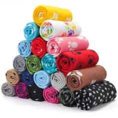 a stack of rolled up towels sitting on top of each other