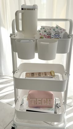 a three tiered cart with items on it