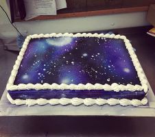 a cake with white frosting and stars on it