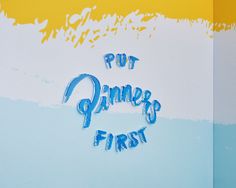 the words put dimmer's first are painted in blue and yellow