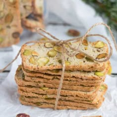 a stack of crackers with nuts tied to them