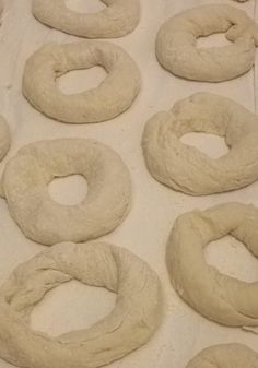 doughnuts are lined up and ready to be baked