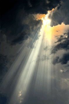 the sun is shining through clouds with light coming from it's centerbeams